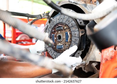 See details of clean old tractor clutch parts. Automobile clutch disc details, spare parts for repair, maintenance, tractor clutch disc, truck clutch disc. auto parts details - Shutterstock ID 2142637627