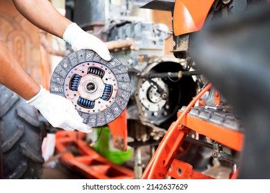See details of clean old tractor clutch parts. Automobile clutch disc details, spare parts for repair, maintenance, tractor clutch disc, truck clutch disc. auto parts details - Shutterstock ID 2142637629