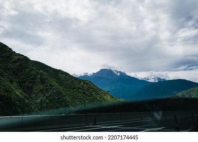 See The Mountains And Fog Outside Through The Car Window