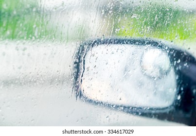 See Through Car Window To Side Rear-view Mirror In Raining Day