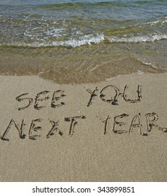 See You Next Year Text Written On The Beach Sand