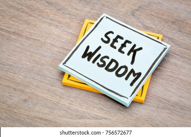 seek wisdom advice or reminder handwriting on a sticky note against grained wood - Shutterstock ID 756572677