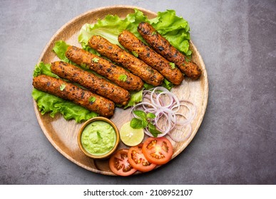 Seekh Kabab made with minced chicken or Mutton keema, served with green chutney and salad
