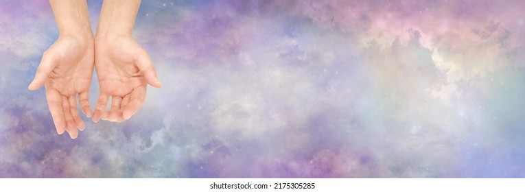 Seeking Cosmic Guidance and sending distant healing- female cupped hands against heavenly cosmic beautiful wide celestial sky background with copy space
				