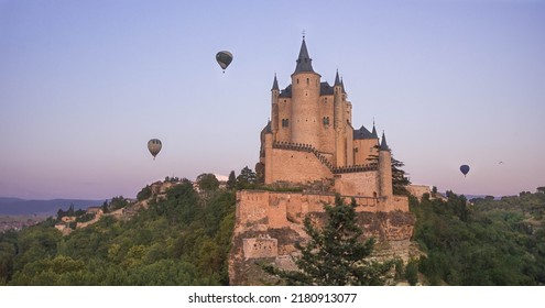 Alcázar Of Segovia With Hot Air Balloons Behind