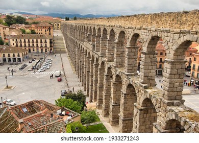 Segovia, Spain - May 30, 2016: People walk near the Roman aquaduct in the town of Segovia, Spain on May 30, 2016