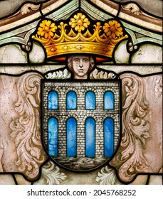 SEGOVIA, SPAIN - Sep 17, 2021: Coat Of Arms Of The City Of Segovia, With The Aqueduct And A Human Head, In A Stained Glass Window Inside The Alcazar