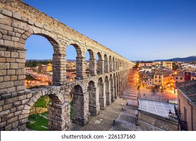 Segovia, Spain town view at Plaza del Azoguejo and the ancient Roman aqueduct. - Powered by Shutterstock