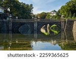 Seimon Ishibashi Bridge leads to the main gate of Imperial Palace. It is known as the Eyeglasses Bridge (Meganebashi) because of its stone-arch reflecting in the water of Nijubashi-moat. Tokyo. Japan