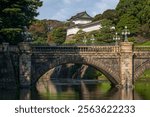 Seimon-seki Bridge and the two-storey keep Fushimi-yagura in the background on a sunny autumn day, Tokyo Imperial Palace, Chiyoda district, Tokyo, Japan