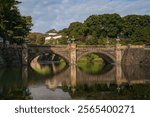 Seimon-seki Bridge and the two-storey keep Fushimi-yagura in the background on a sunny autumn day, Tokyo Imperial Palace, Chiyoda district, Tokyo, Japan