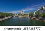 Seine and back side of Notre Dame de Paris timelapse hyperlapse is the one of the most famous symbols of Paris. View from Tournelle bridge with boats on river at sunny summer day