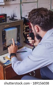 Seismologist Pointing At The Equipment (soft Focus On His Hand)