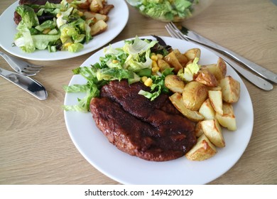 Seitan Steak With Potato Wedges And Salat, Vegan Meal