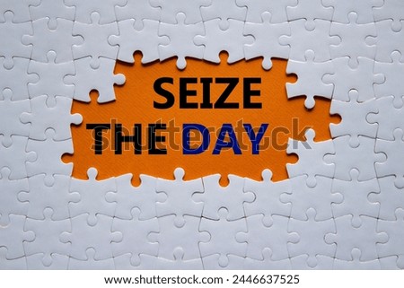 Seize the day symbol. White puzzle with words Seize the day. Beautiful orange background. Business and Seize the day concept. Copy space.