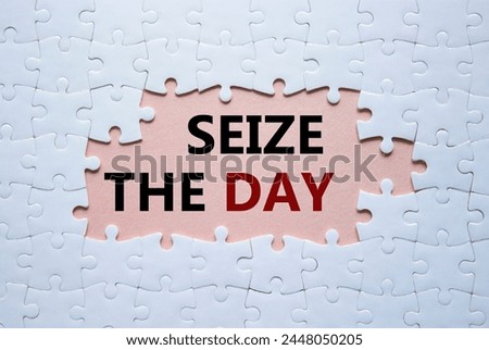 Seize the day symbol. White puzzle with words Seize the day. Beautiful pink background. Business and Seize the day concept. Copy space.
