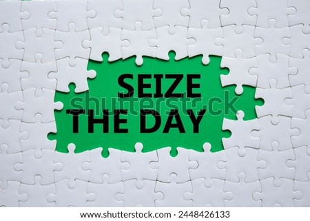 Seize the day symbol. White puzzle with words Seize the day. Beautiful green background. Business and Seize the day concept. Copy space.