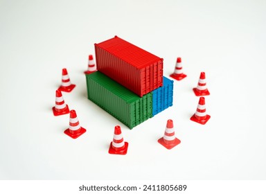 Seizure of cargo. Sea containers are surrounded by road cones and are inaccessible for transportation. Legal or logistical challenges hindering the movement of goods. Shipping complexities disruptions