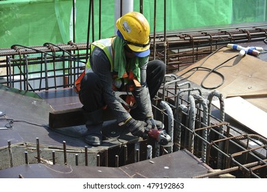 SELANGOR, MALAYSIA -AUGUST 29, 2016: Construction workers cutting reinforcement bar using mobile grinder at the construction site in Selangor, Malaysia.  - Shutterstock ID 479192863
