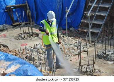 SELANGOR, MALAYSIA â?? MARCH 28,  2015: Construction Workers Spraying The Anti Termite Chemical Treatment At The Construction Site.