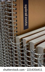 Selangor, Malaysia - Oct 10, 2022: Vertically Arranged Spiral Bound Notebook With Brown Paper Cover At A Bookstore. Books And Stationery Concept.