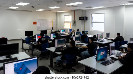 SELANGOR,MALAYSIA-MARCH 8,2018: A college students are designing and doing analysis in CAD software. Working on their project assignment in lab design near Bangi,Selangor. Shot taken on March 8,2018.