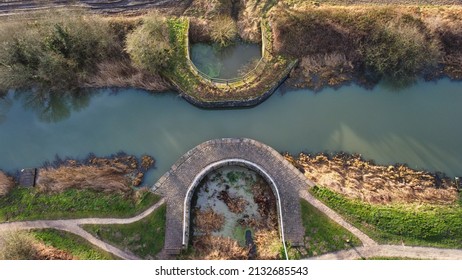 Selby, North Yorkshire, England, Britain, March, 2022, Aerial view of flood tunnel collection ponds (sumps) on Selby Canal listed architecture from industrial revolution designed by William Jessop