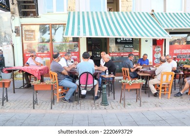 Selcuk Turkey, September 2022. Group Of Men Playing Card Game At A Cafe Located In Selcuk, Turkey. Turkish People Habits