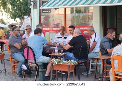 Selcuk Turkey, September 2022. Group Of Men Playing Card Game At A Cafe Located In Selcuk, Turkey. Turkish People Habits