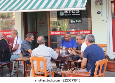 Selcuk Turkey, September 2022. Group Of Men Playing Card Game At A Cafe Located In Selcuk, Turkey. Turkish People Habits