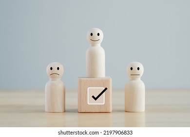 Select Happy Face Figure On Top Of Wooden Blocks. Evaluation, Performance Appraisal, Skill, Success, Expert, Leadership. Human Resources Management Choosing Positive Attitude To Team Leader.