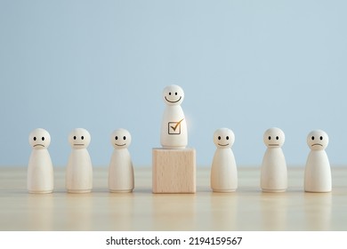 Select Happy Face Wooden Figure. Customer Service Rating Experience And Feedback Emotion And Satisfaction Survey. Human Resources Management Choosing Positive Attitude To Team Leader.