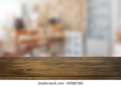 Selected focus empty brown wooden table and space of Coffee shop blur background with bokeh image, for product display montage