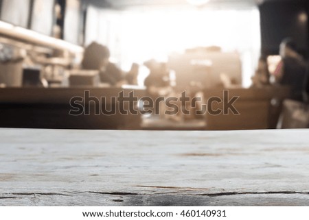 Selected focus empty brown wooden table and Coffee shop blur background.for your photomontage or product display