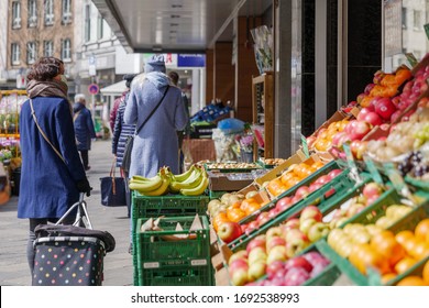 Selected Focus, European People Queue Outside In Front Of Food Stall And Supermarket During Quarantine For COVID-19 Virus In Europe.