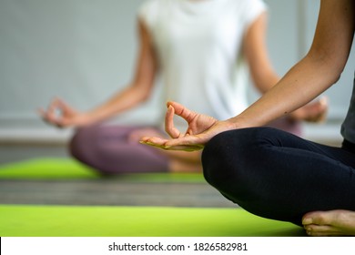 selected focus at hands sign caucasian woman doing yoga exercise workout on yoga mat in  with  instructor  teaching and pose adjusting - Shutterstock ID 1826582981