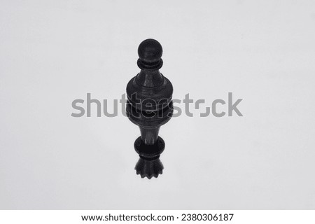 Selected focus on the black Pawn with the shadow of the black Queen.