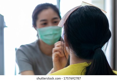 Selected Focus On Model For Makeup. Makeup Artist Wearing Face Mask Doing Makeup For Girl Indoor During Covid 19. Makeup Artist Doing Make Up For Young Beautiful Bride.