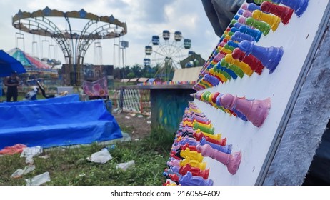 Selected Focus Shot Of Colorful Chess Pawns On Blurred Merry Go Round Background