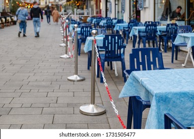 Selected focus at vacant outdoor tables and seats area of restaurant without customer during social distancing and global quarantine from epidemic of COVID-19 virus. Impact of COVID-19 at restaurant.