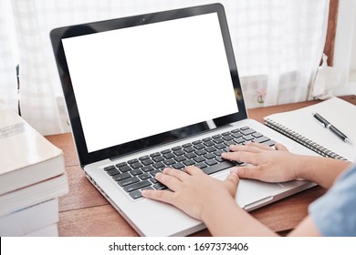 Selected foucs on laptop with,Asian smart boy using laptop with blank white screen to study. Student boy, School, Online education and learning at home concept.