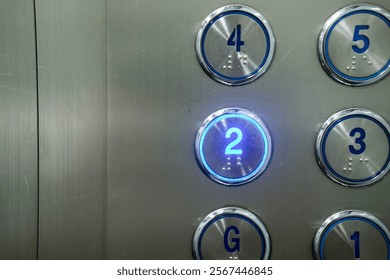 Selecting a numbered floor. 2nd floor. Elevator keypad. The second floor button in the elevator.