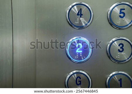 Selecting a numbered floor. 2nd floor. Elevator keypad. The second floor button in the elevator.