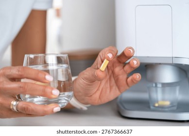 Selecting a single capsule from a dose to ensure precise intake. Individual selection supports dosing accuracy and reduces the risk of medication errors.