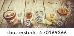 Selection of alcoholic drinks on rustic wood background