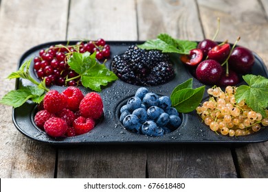 Selection of berries in cupcake form - healthy dessert concept