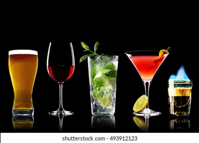 Selection of best selling drinks beer glass of wine  cocktails martini mojito and shot short  bar blurred background
