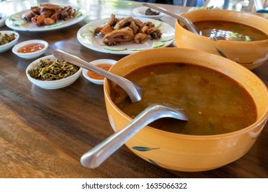 Selection Of Burmese Dishes In Rural Myanmar With Skinny Chicken And Traditional Soup