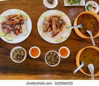 Selection Of Burmese Dishes In Rural Myanmar With Skinny Chicken And Traditional Soup