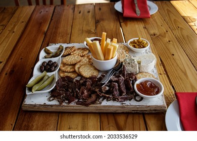 A selection of cheeses, jams, biscuits and biltong